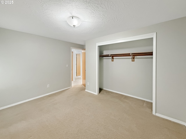 573 SE 73rd Ave, Hillsboro, OR 97123 - unfurnished bedroom with a closet, light carpet, and a textured ceiling
