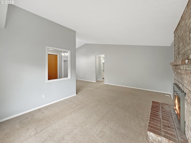 573 SE 73rd Ave, Hillsboro, OR 97123 - unfurnished living room with vaulted ceiling, a fireplace, and carpet floors