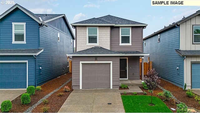 traditional home with a garage, concrete driveway, and a shingled roof