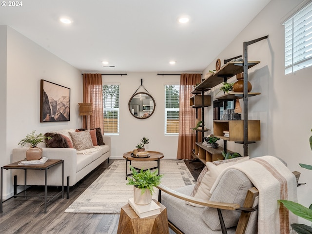 sitting room featuring baseboards, dark wood-style flooring, and recessed lighting