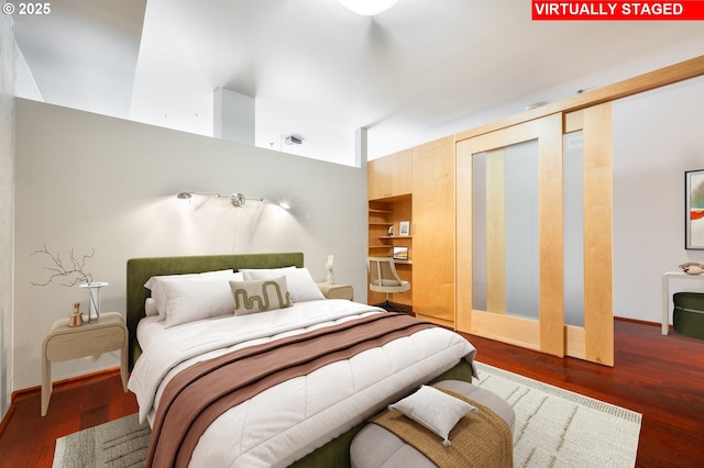 1221 SW 10th Ave Unit 311, Portland, OR 97205 - bedroom featuring wood finished floors and baseboards
