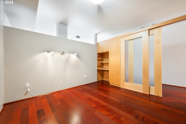 1221 SW 10th Ave Unit 311, Portland, OR 97205 - unfurnished bedroom with wood finished floors and multiple closets