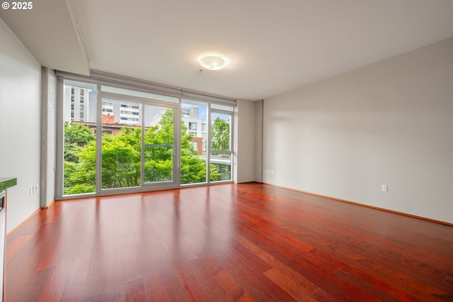 1221 SW 10th Ave Unit 311, Portland, OR 97205 - empty room featuring healthy amount of natural light and wood finished floors