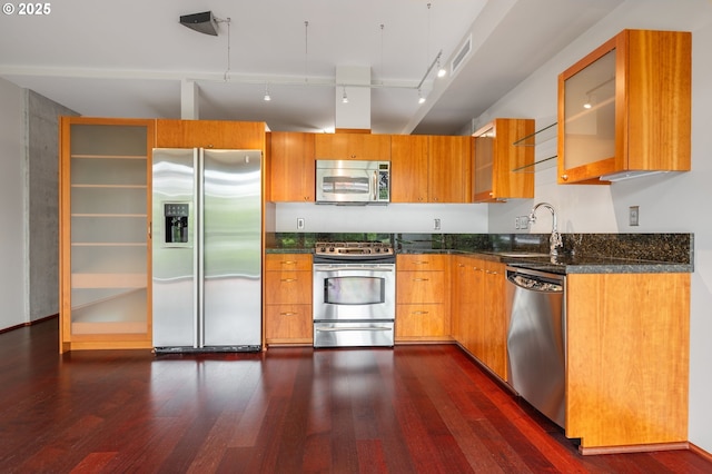 1221 SW 10th Ave Unit 311, Portland, OR 97205 - kitchen featuring appliances with stainless steel finishes, a sink, dark wood-style floors, glass insert cabinets, and track lighting