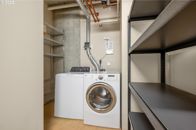 1221 SW 10th Ave Unit 311, Portland, OR 97205 - laundry area featuring washer and clothes dryer