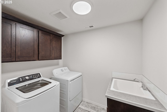 764 Seacrest Dr, Bandon, OR 97411 - washroom featuring cabinet space, independent washer and dryer, and baseboards