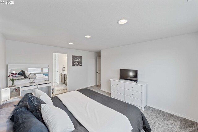 764 Seacrest Dr, Bandon, OR 97411 - bedroom featuring light colored carpet, recessed lighting, baseboards, and connected bathroom