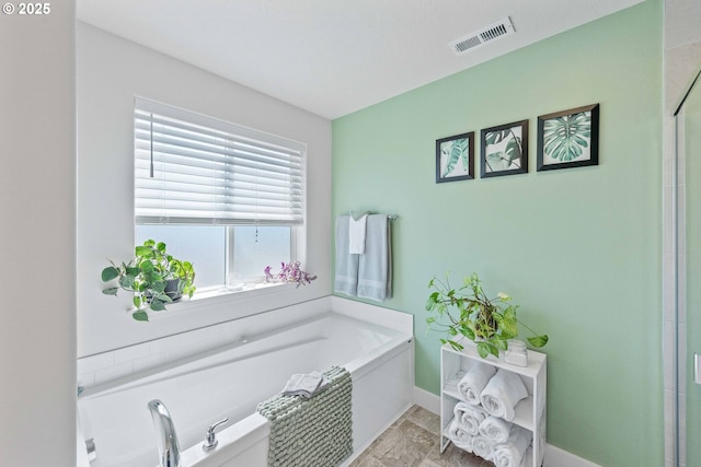 764 Seacrest Dr, Bandon, OR 97411 - bathroom featuring a garden tub, baseboards, and an enclosed shower