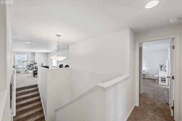 764 Seacrest Dr, Bandon, OR 97411 - hall featuring carpet, an upstairs landing, recessed lighting, a textured ceiling, and baseboards
