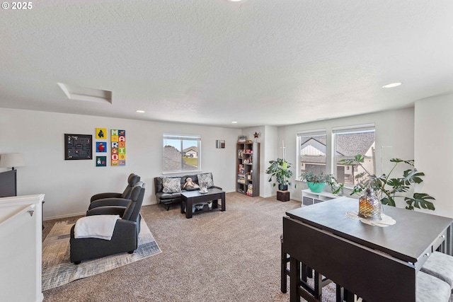 764 Seacrest Dr, Bandon, OR 97411 - carpeted living room with a textured ceiling, healthy amount of natural light, recessed lighting, attic access, and baseboards