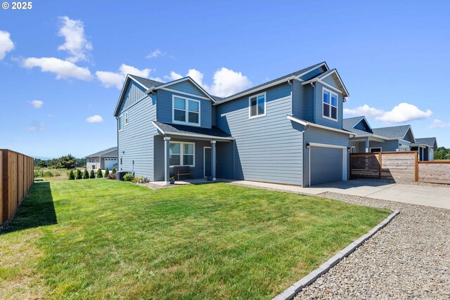 764 Seacrest Dr, Bandon, OR 97411 - back of property with concrete driveway and an attached garage