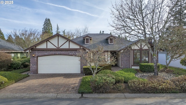 tudor house featuring a garage