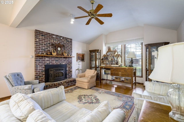 living room with hardwood / wood-style flooring, ceiling fan, and lofted ceiling