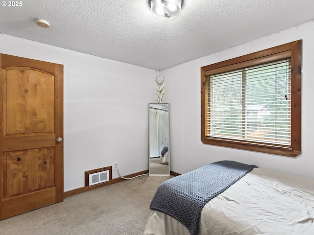 54934 E Kirkwood Dr, Sandy, OR 97055 - bedroom featuring light carpet, a textured ceiling, and baseboards