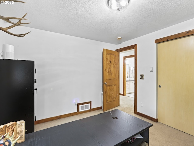 54934 E Kirkwood Dr, Sandy, OR 97055 - office space with a textured ceiling, baseboards, and light carpet