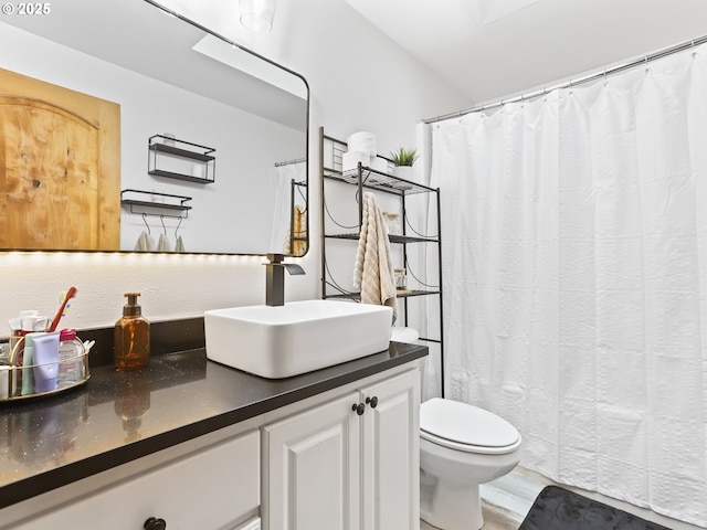 54934 E Kirkwood Dr, Sandy, OR 97055 - full bath featuring toilet, vanity, wood finished floors, and a shower with curtain
