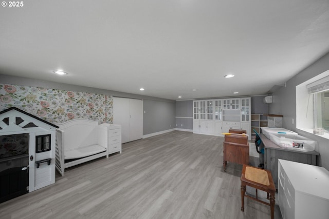 playroom featuring light wood finished floors, baseboards, recessed lighting, and wallpapered walls