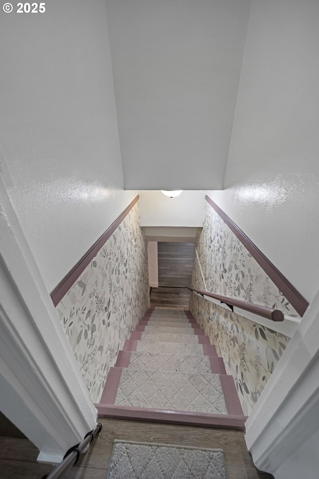 staircase with wood finished floors