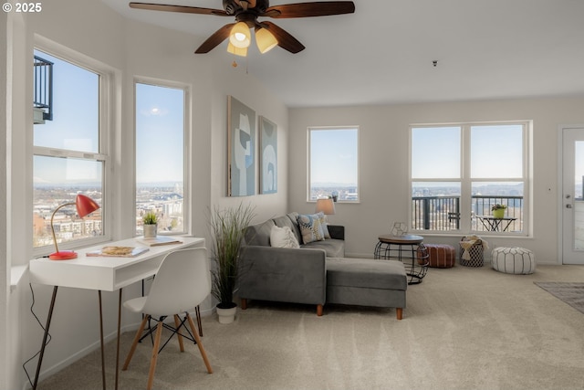 interior space featuring carpet flooring, plenty of natural light, and ceiling fan