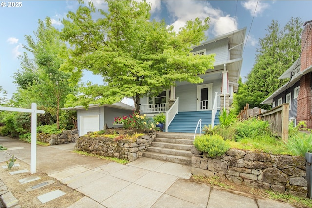 1823 SE 34th Ave, Portland, OR 97214 - view of front of property with a porch, stairs, and a garage