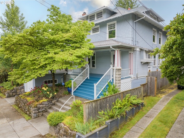 1823 SE 34th Ave, Portland, OR 97214 - american foursquare style home featuring stairway, a porch, a chimney, and roof with shingles