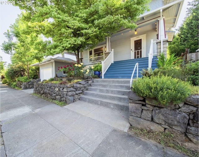 1823 SE 34th Ave, Portland, OR 97214 - view of front of house with a porch, a garage, and stairs