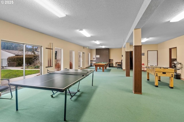 playroom featuring pool table, carpet, and a textured ceiling