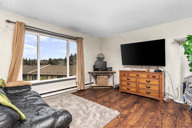 living room featuring dark wood-type flooring, a textured ceiling, and a baseboard heating unit