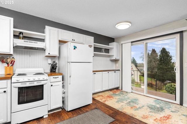 kitchen featuring dark wood-type flooring, white cabinets, and white appliances