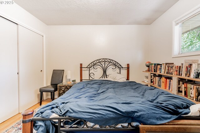 9023 SE Ankeny St, Portland, OR 97216 - bedroom featuring a closet and wood finished floors