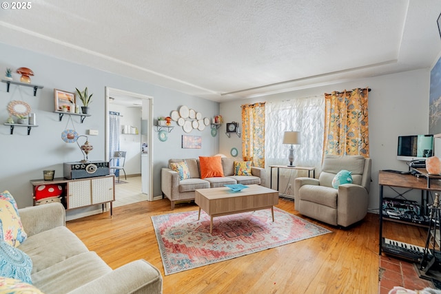 9023 SE Ankeny St, Portland, OR 97216 - living room with a textured ceiling and wood finished floors
