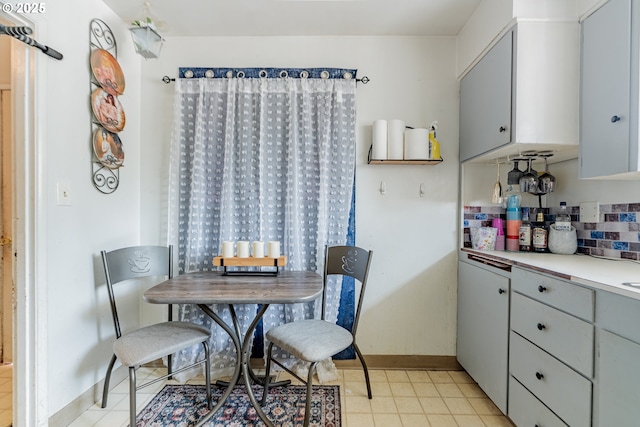 9023 SE Ankeny St, Portland, OR 97216 - dining room featuring light tile patterned flooring and baseboards
