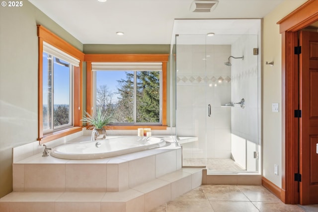 bathroom featuring independent shower and bath and tile patterned flooring