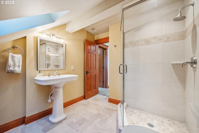 bathroom with lofted ceiling with beams and walk in shower