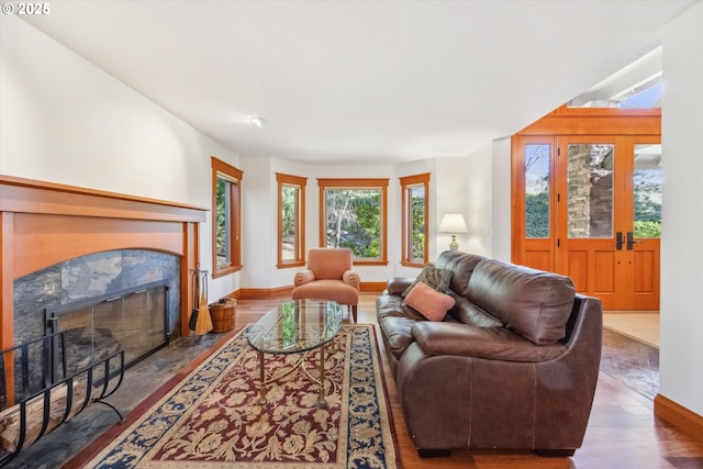 living room featuring dark hardwood / wood-style floors and a high end fireplace