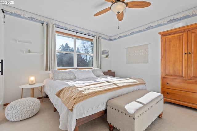 carpeted bedroom with ceiling fan