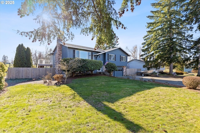 exterior space with a garage and a front lawn