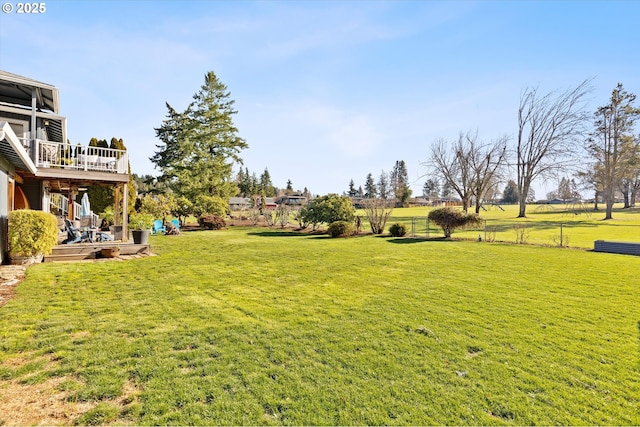 view of yard featuring a wooden deck