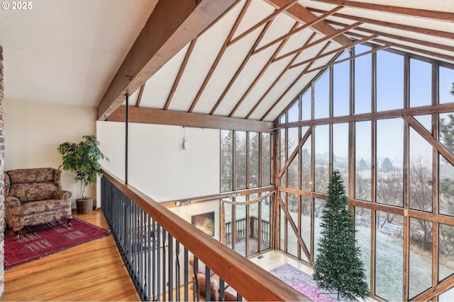 interior space featuring vaulted ceiling with beams