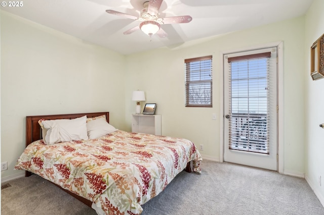 carpeted bedroom featuring access to exterior and ceiling fan