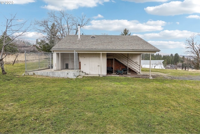 view of outbuilding with a yard