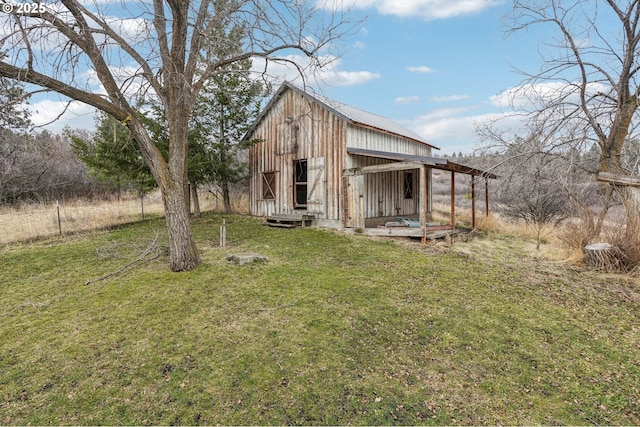 exterior space with a yard and an outdoor structure