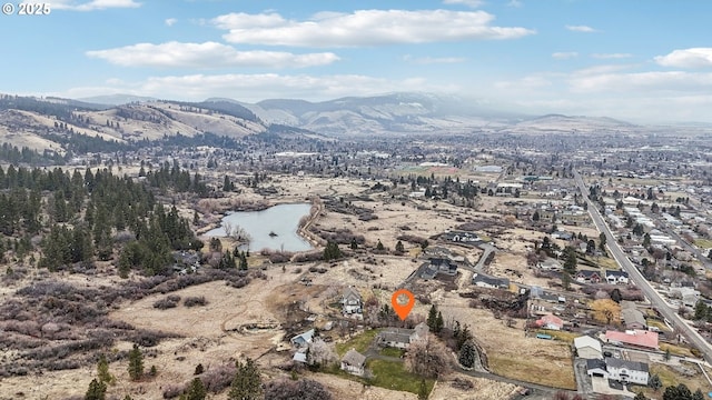 bird's eye view with a water and mountain view