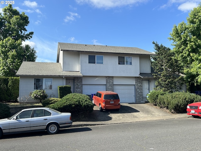 14818 NE Fremont St, Portland, OR 97230 - view of front facade featuring driveway, a garage, and brick siding