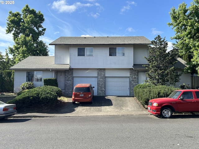 14818 NE Fremont St, Portland, OR 97230 - view of front of property with concrete driveway, a garage, and roof with shingles
