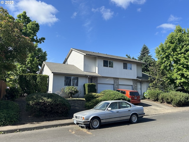 14818 NE Fremont St, Portland, OR 97230 - view of front of property with driveway and an attached garage