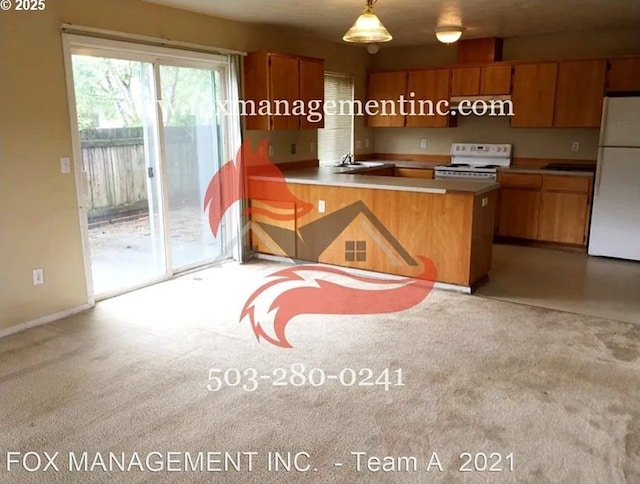 14818 NE Fremont St, Portland, OR 97230 - kitchen with white appliances, a peninsula, brown cabinets, carpet flooring, and decorative light fixtures