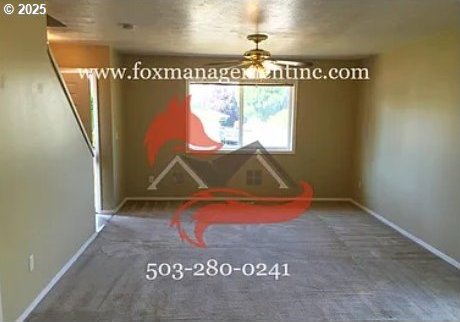 14818 NE Fremont St, Portland, OR 97230 - carpeted dining room featuring baseboards and ceiling fan