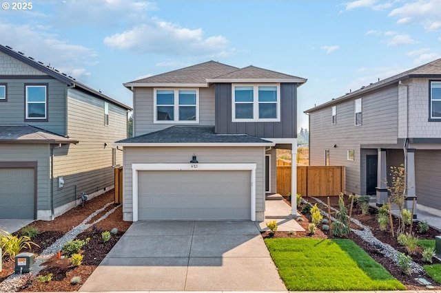 274 Greencrest St, Salem, OR 97301 - view of front of home featuring board and batten siding, a garage, concrete driveway, and roof with shingles
