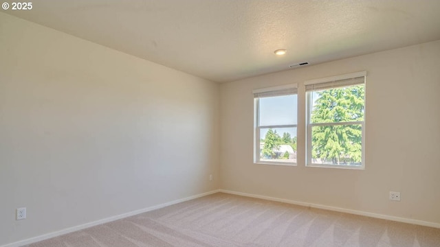 274 Greencrest St, Salem, OR 97301 - empty room featuring light carpet and a textured ceiling